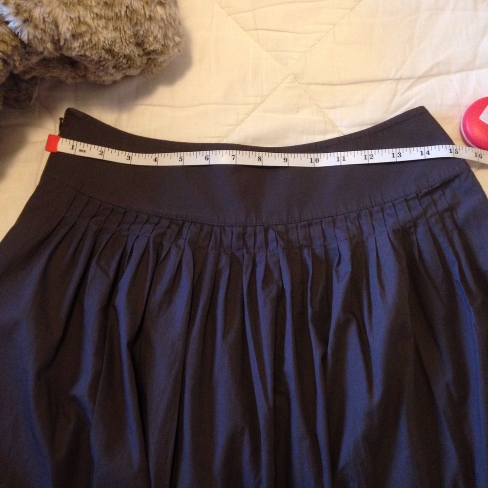 Apostrophe Pleated Skirt